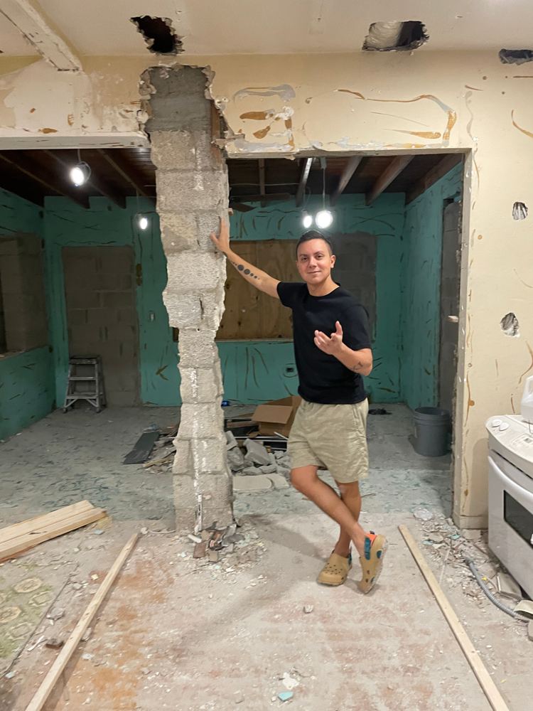 William mid-demo inside a Miami house we bought
